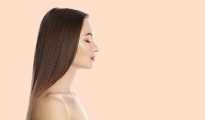 Naklejka premium Young woman with beautiful face on light background, space for text