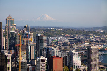 Mount Rainier towers over the skyline of Downtown Seattle, Washington