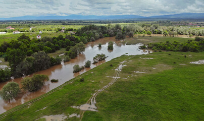 Fototapeta na wymiar Flooded field with farm after heavy rains storm