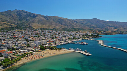 Obraz premium Aerial drone photo of famous seaside town and port of Karistos in South Evia island, Greece