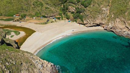 Aerial drone photo of secluded sandy emerald beach and canyon of Agios Dimitrios near Karistos, South Evia island, Greece