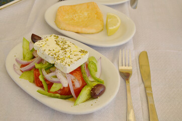 Traditional Greek salad with fried cheese Saganaki.