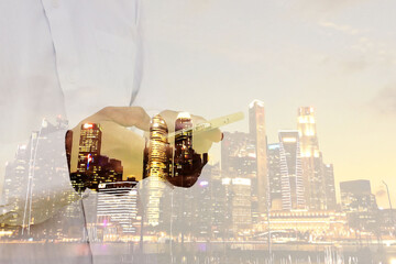 businessman Use smartphone technology to contact for investment.