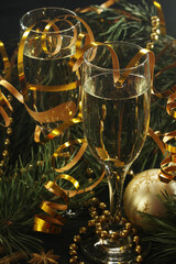 Fototapeta na wymiar Two glasses with champagne in New Year Eve