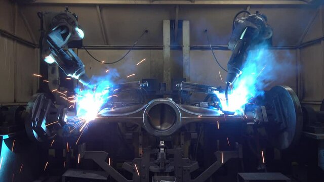 Automation welding mechanical procedure.,Industrial Robot arm active in factory