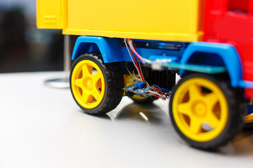 A blue yellow and red toy car