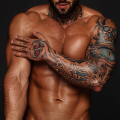Bodybuilder with muscle torso. Banner image of sexy man with muscular body. Portrait of sexi male model. Hot macho in abs poses on black background. 16 in 9 crop for design