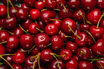 Fresh ripe black cherries background Top view 