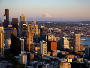 View of Mount Rainier over the skyscrapers of downtown Seattle at dusk 