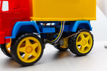 A blue yellow and red toy car