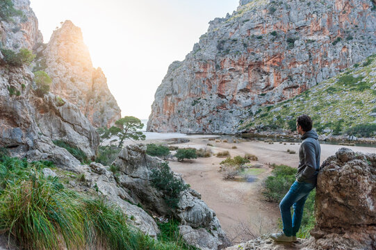 Man enjoying nature lookng to the sea, Mallorca, Spain