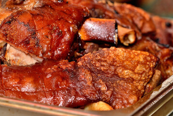 Heap of roasted smoked pork knuckles. BBQ.