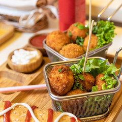 Fried chicken, potatoes close up