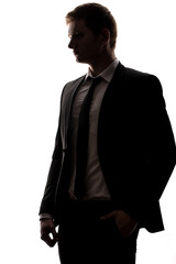 one caucasian business man handsome full suit standing full length serious silhouette in studio isolated white background