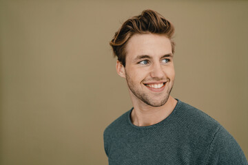 Portrait of a confident young man, smiling