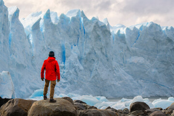 Man in front of Perito Moreno Glacier, El Calafate, Los Glaciares National Park, Patagonia, Argentina
