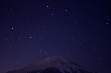 Mount Fuji with snowcap & starry night, from Lake Yamanaka, Japan