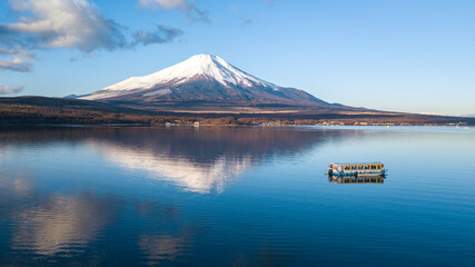 Inverted Mt Fuji with a tourist boat on Lake Yamanaka, Japan
