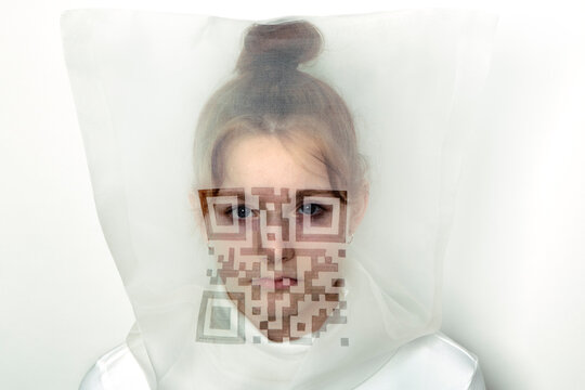 Portrait of teenage girl wearing  transparent mask with QR Code