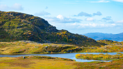 autumn landscape with lake and mountains