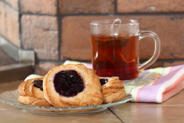 Marzipan cookies with jam and cup of tea