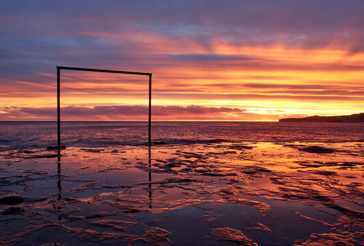 Scenic view of sea against orange sky during sunset, Puerto Piramides, Argentina