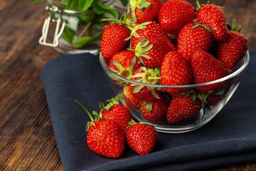 Red ripe fresh strawberry with leaves close up
