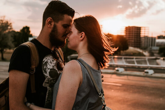Affectionate young couple embracing at a street at sunset, Berlin, Germany