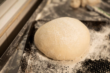 hands of the master baker in bread production