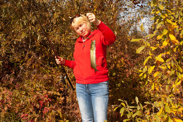 woman with fishing rod and pike autumn