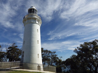 scenic  of beautiful view at table cape  with white light house and clear sky and white cloud around big trees.table cape conservation area tasmania australia
