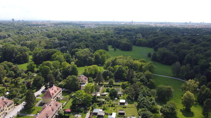 drone shot over green trees munich englischer garten