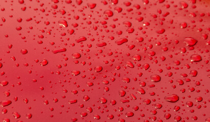 Close up raindrop on red car, After  raining
