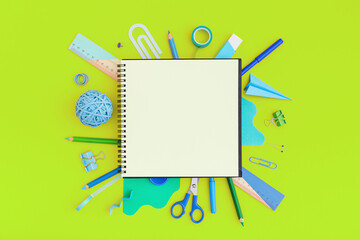 Back to school background. Notebook and school stationery on green background.