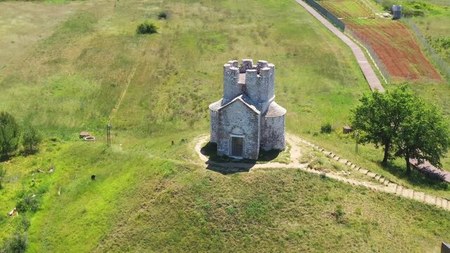 Medieval stone church of St. Nicholas (Sveti Nikola) from 12th century near Nin, Dalmatia, Croatia, drone aerial view