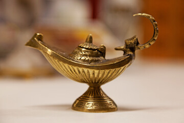 Fototapeta na wymiar Aladdin's magic lamp in copper color found on flea market