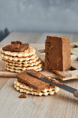 Viennese waffles with Norwegian brunost cheese. Breakfast with Traditional Scandinavian brown cheese