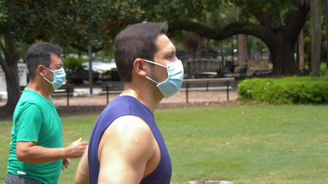 482 Side shot of two people going for a jog during covid19 pandemic