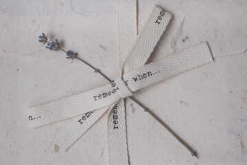Vintage envelope with beige ribbon. Eco-friendly handmade paper. Sprig of lavender.