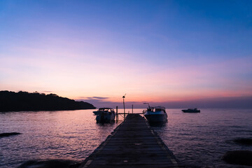 Fototapeta premium Silhouette sunset on the pier at koh kood, trat, thailand