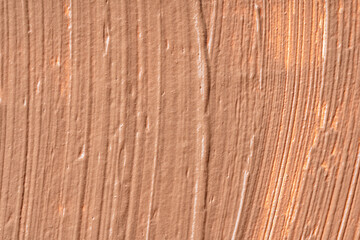 Background of a smudged cream foundation texture