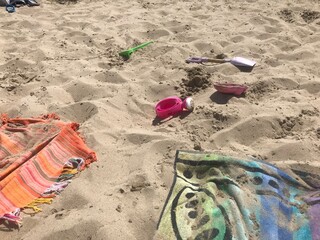 Children toy at the beach. Summer time during covid 19