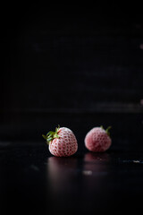 fresh and juicy strawberry on black background © Katarzyna