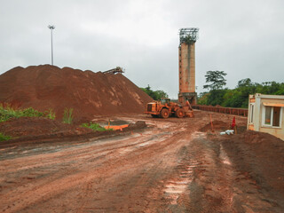 Mine Site in Yekepa, Liberia, 10 of June 2015. West Africa. Iron Ore Mining operator loads train...