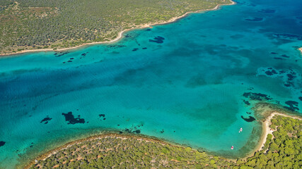 Aerial drone photo of beautiful paradise island complex in gulf of Petalion that form a blue lagoon in South Evia island near Marmari, Greece