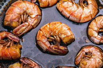 fried shrimp in a pan in the home kitchen. Grilling food in a pan. Fish delicacy.