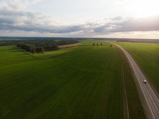 Fototapeta premium Top view of the road in summer evening. View from drone