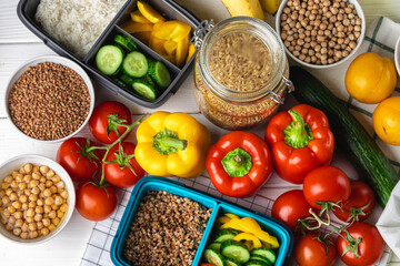 Lunch box with cooked buckwheat and fresh vegetable salad