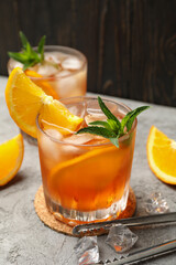 Composition with aperol spritz cocktail on gray background. Summer drink