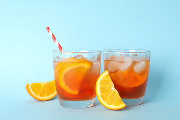 Aperol spritz cocktail on blue background. Summer cocktail